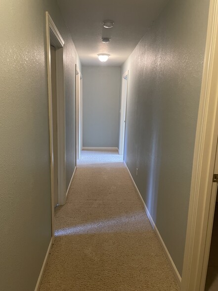 Second floor hallway, 23 red bedrooms, bathroom and laundry room - 5185 Samuelson Rd