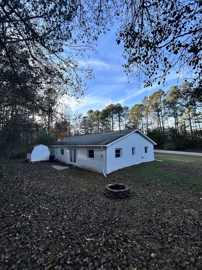 Small patio with shed in back - 2162 Fence Rd