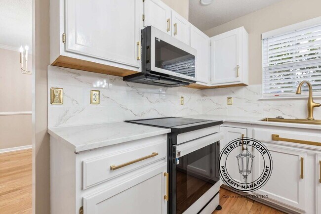 Building Photo - "Charming 4-Bedroom Retreat with Fireplace & Hardwood Floors on Michelle Drive!"