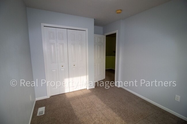 Building Photo - Forest Hills 3 Bed Townhome with Garage, Pond View and Some Utilities Included
