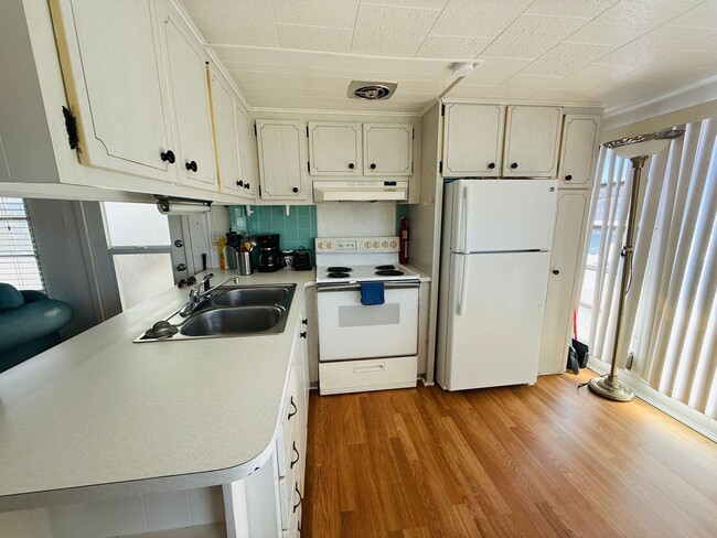 Building Photo - Beautiful fully furnished one bedroom, one bath manufactured home in a 55+ deed restricted gated ...