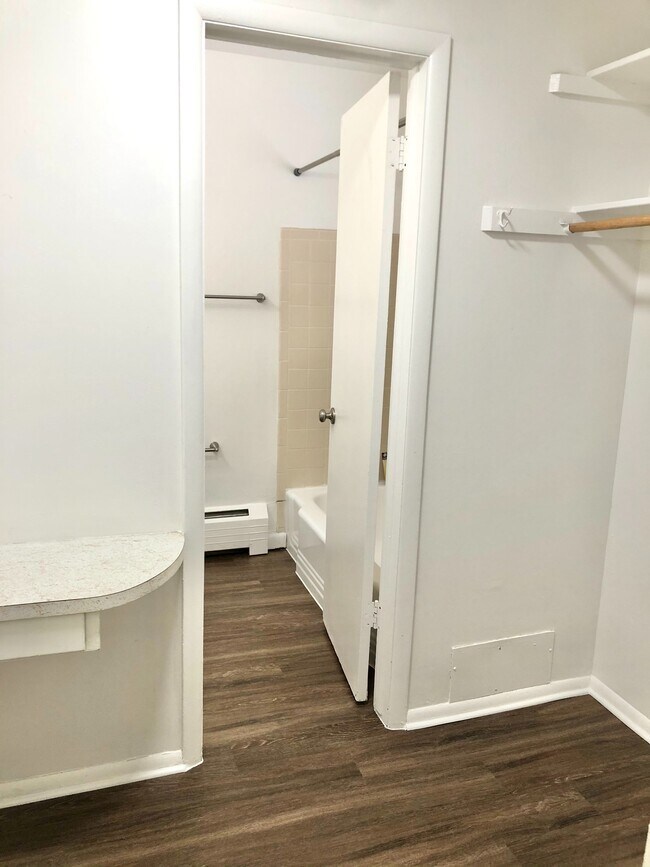 Step into elegance with a chic bathroom entrance and ample closet space. - GRACE LANDINGS APARTMENTS