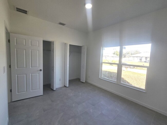 Building Photo - Brand New 2/2/1-PRIME SW LOCATION - Lehigh Acres