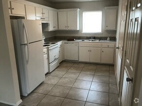 Building Photo - Plum Duplexes