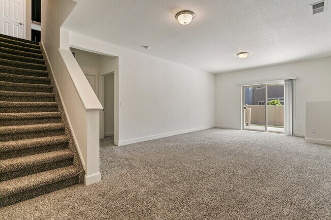Building Photo - Spacious Banning Lewis Home with Finished ...