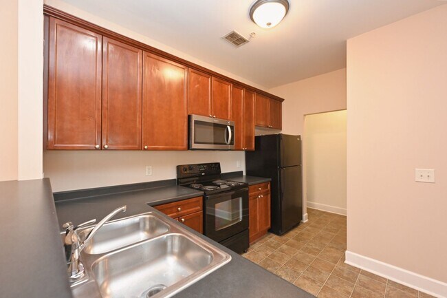 Building Photo - **PRISTINE GARDEN-LEVEL CONDO ON THE FIRST LEVEL NEAR PAVILION AND COMMUNITY GREEN SPACE**
