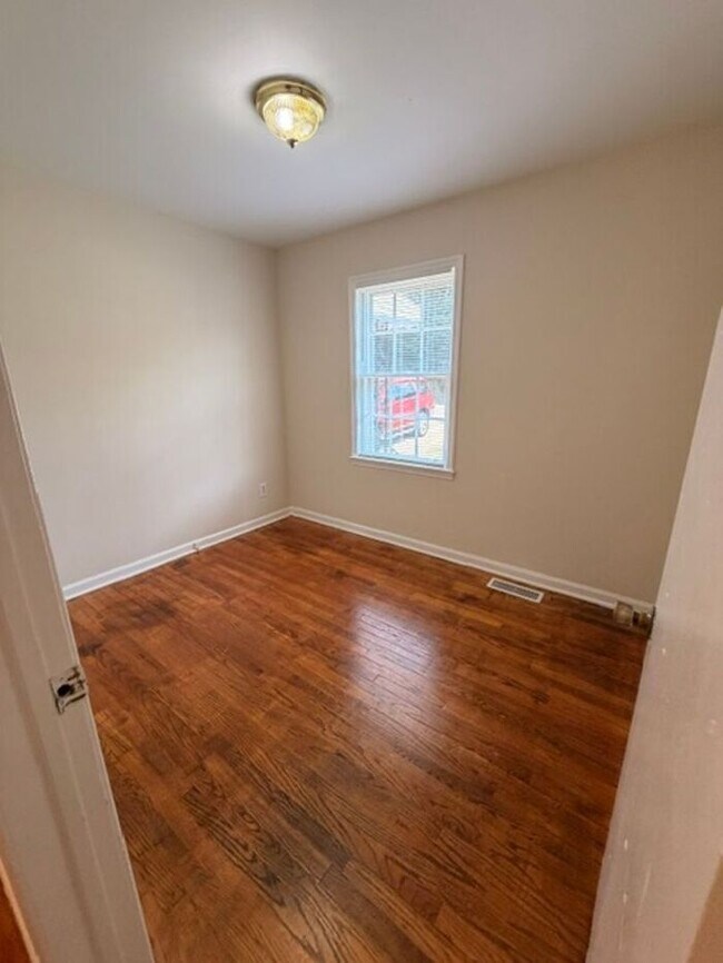 Building Photo - Three bedroom brick home available now!
