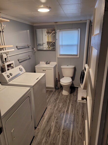 Bathroom with W/D Units, new vanity, and freshly tiled custom shower - 1132 N Trimble Rd