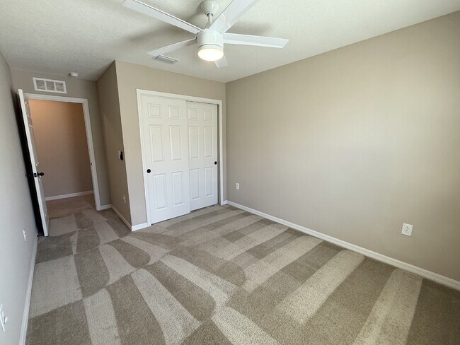 Building Photo - Spacious 4-Bedroom Retreat with additional office/den in the Heart of Trinity!