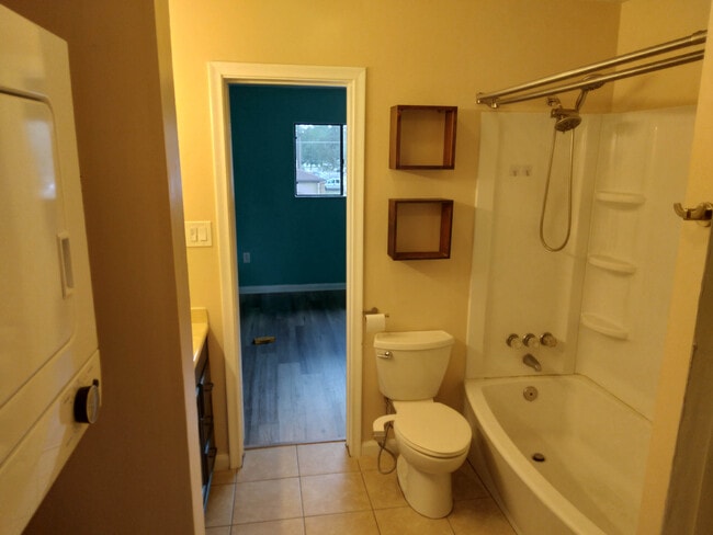 bathroom with tub and bidet - 4415 NW 41st Plz
