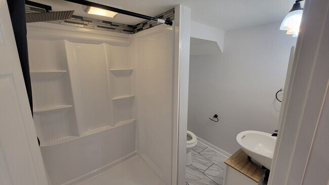 Building Photo - 3 Bedroom With A Finished Basement And Large Back Yard