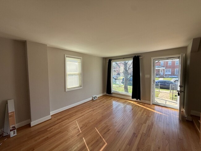 Building Photo - End Unit 3BR Townhome in Dundalk | Fresh Paint, Refinished Hardwood Floors, Fenced Yard, Off-Stre...