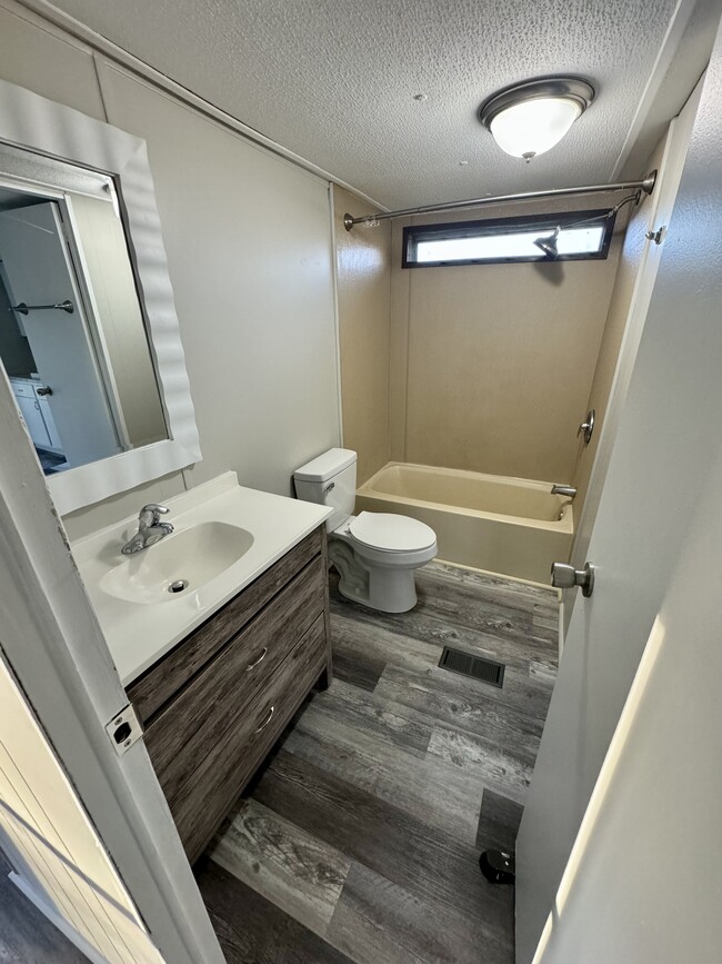 Guest bathroom with new toilet, vanity, plumbing - 1057 Shiloh Rd N