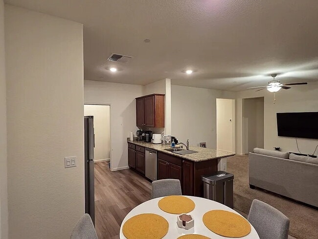 Building Photo - This stunning three-bedroom, two-bathroom home offers an incredible amount of space and upgrades,...