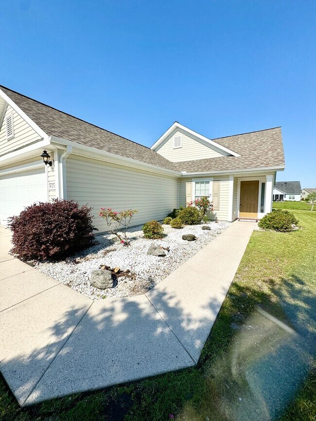 Building Photo - Like New 3 Bedroom & 2 Bath pond front home in Hillsborough! Enjoy the Community Pool, Playground...