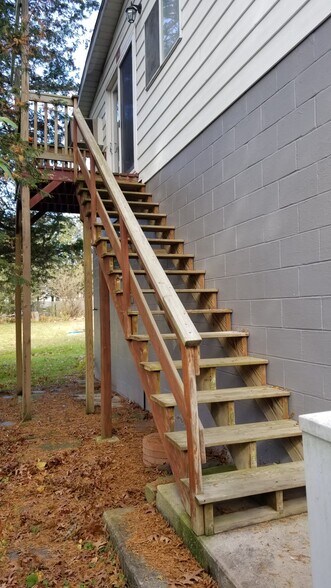 Staircase up to the apartment - 715 Main Street