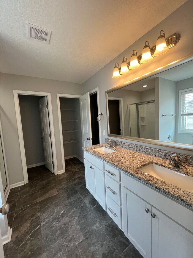 Building Photo - Spacious 4-Bedroom Pet Friendly Home with a Serene View - Available for Rent!
