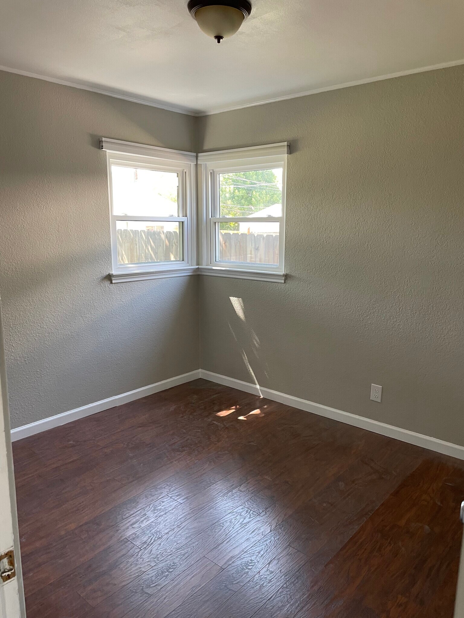 Bedroom 2 - natural light and new ceiling fan installed - 1335 Dallas St
