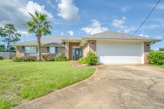 Building Photo - Navarre 4BR, 2BA Home with Open Floor Plan, Split Bedrooms, Wood-Look Flooring, 2-Car Garage & Fe...