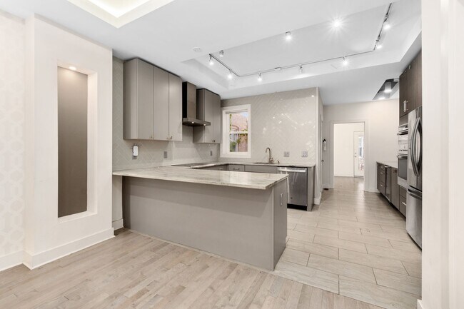 Building Photo - Experience stunning design and modern finishes in Columbia Heights!