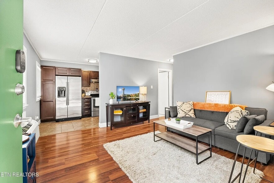 Living Room: Sleeper Couch, Floor Lamp, End Tables, Coffee Table, Smart TV, WIFI, Rug. - 2718 Painter Ave