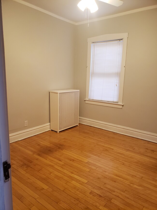 Bedroom #2 freshly painted with hardwood floors - 3811 N Central Park Ave