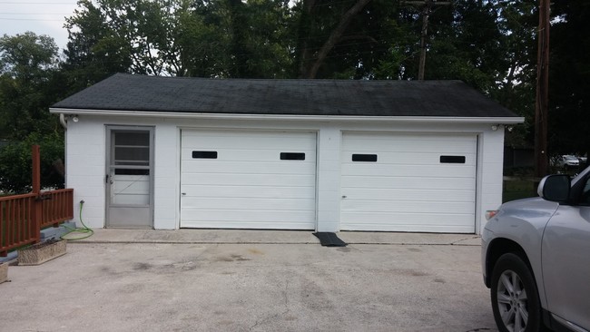 Huge garage with new garage doors - 202 Colonial Dr