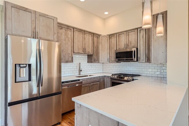 Building Photo - Modern 4BR Townhome Near Sloan’s Lake | Rooftop Deck, Finished Basement & Garage