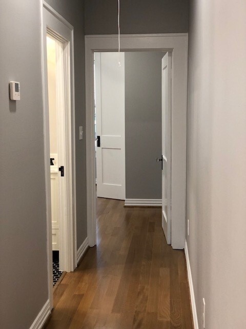 hallway from main kitchen/living area leading to bathroom and bedroom in back - 1742 W Main St