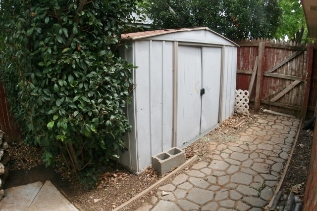 Building Photo - Brick 3 Bedroom Home! Stunning Backyard! M...