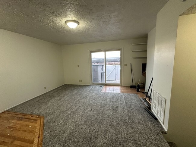 Building Photo - Spacious, three level, 4 Bed 2.5 bath Townhome in Ammon right behind the Walmart on Hitt.