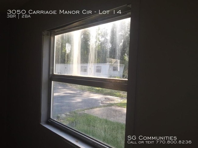 Building Photo - 3050 Carriage Manor Cir