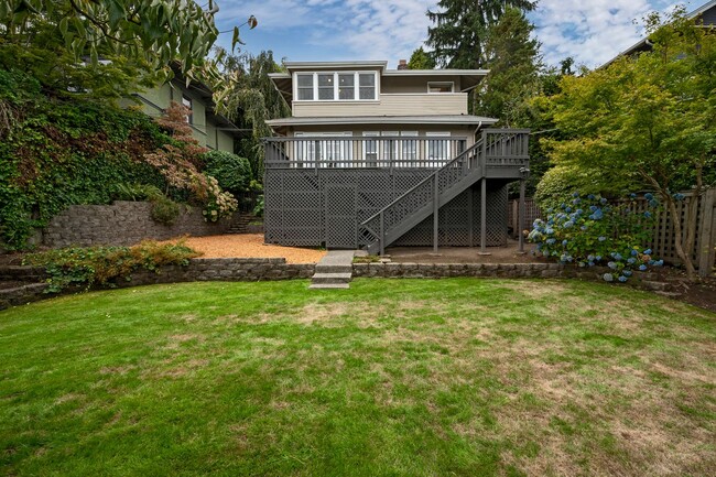 Building Photo - Traditional Four-Corner Craftsman Home on ...