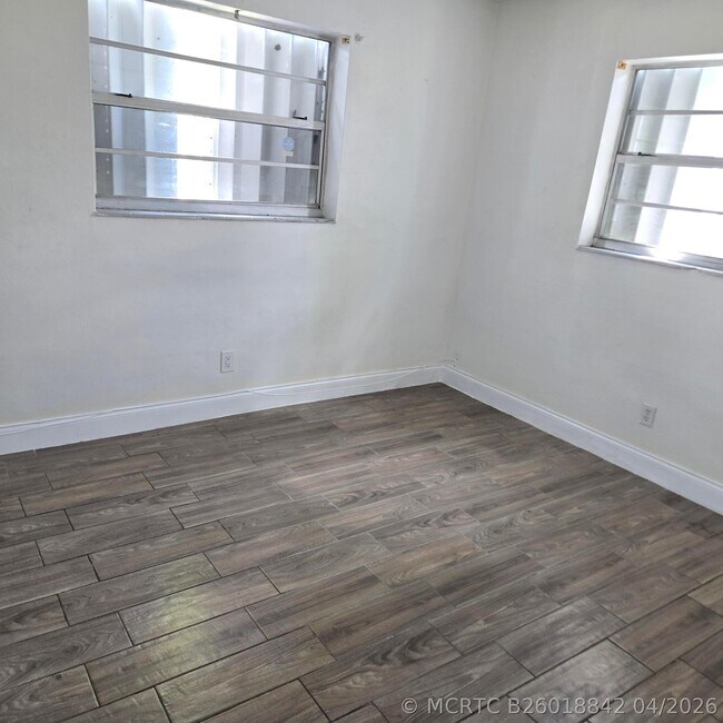 Building Photo - 3860 NW 8th Pl
