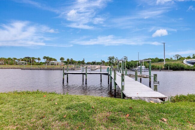 Building Photo - A BOATER'S PARADISE WITH THIS STUNNING 3 BEDROOM, 2 BATH WATERFRONT POOL HOME W/DOCK & BOAT LIFT ...