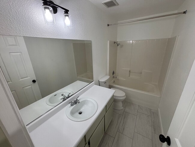 Building Photo - This inviting single-story home boasts a s...