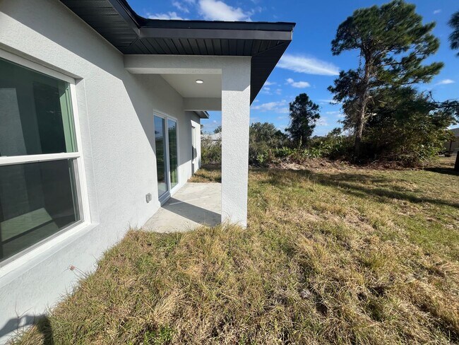 Building Photo - Brand-New 4BR/2BA Luxury Home with 2-Car Garage – Desirable 33971 Location