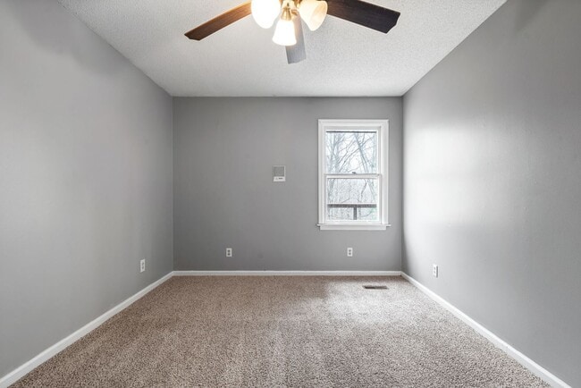 Building Photo - Lovely home on beautiful, wooded corner - Just Reduced