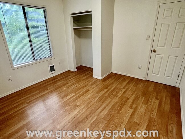 Building Photo - This 3-bedroom 1-bathroom house has a large front yard and a mostly fenced backyard.