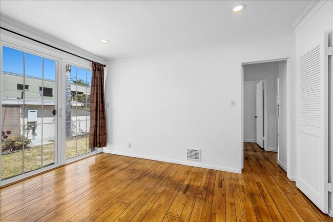 Building Photo - Corner lot home on a classic tree lined Beverly Hills street