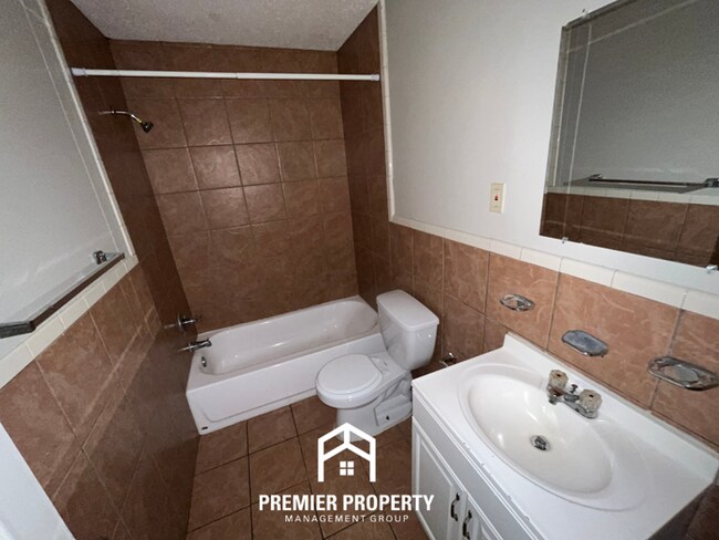 Building Photo - Charming 3BR/2BA in 38118 | Low-Maintenance Tile Floors, Bay Window & Patio