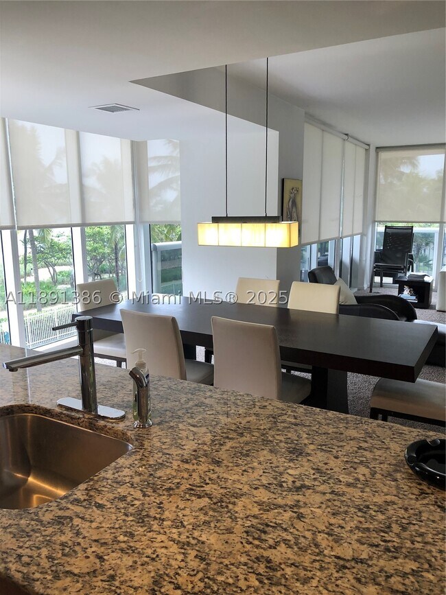 Building Photo - 10275 Collins Ave