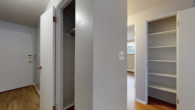 Step into this inviting space with plenty of storage options. - Harmony Apartments
