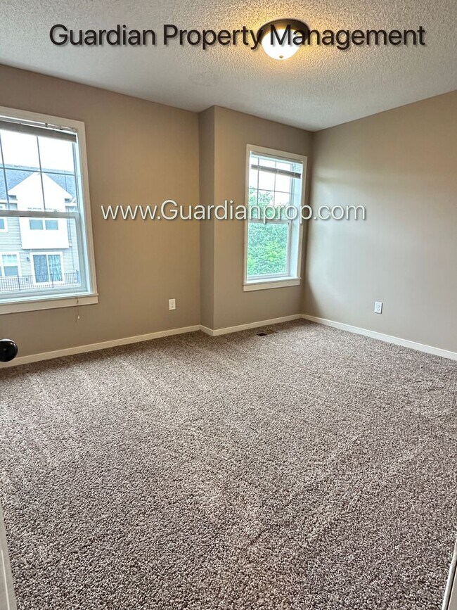 Building Photo - Champlin Town Home, 2 Car Garage, Dishwasher, Washer/Dryer, Balcony, July/Aug 1st Move In