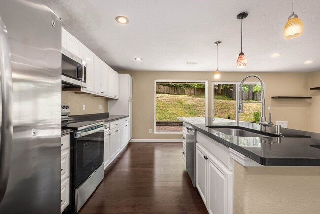 Building Photo - Updated Charmer with Open Kitchen, Private Yard & 2-Car Garage