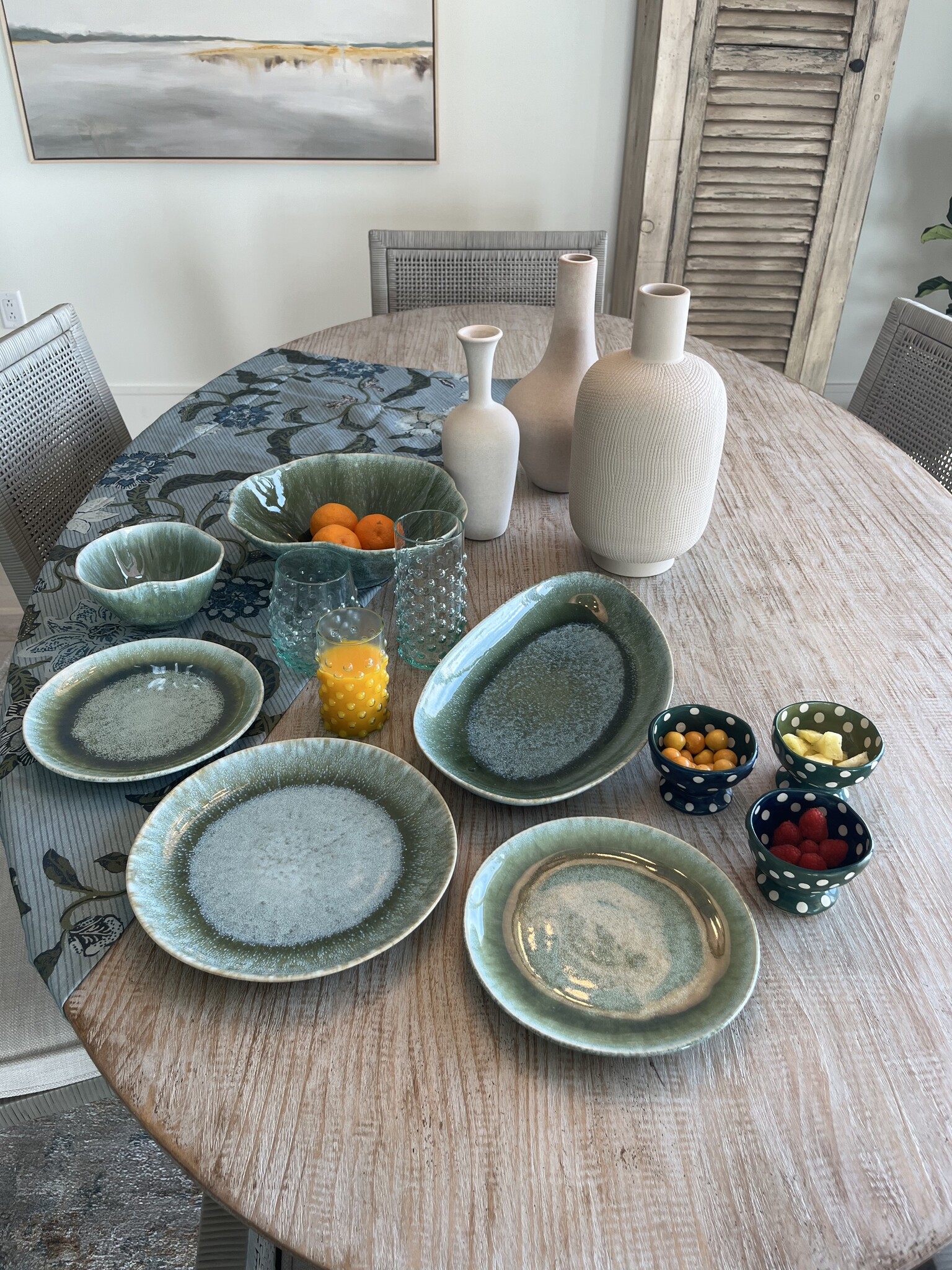 Beautiful coordinating dishes, tablecloth and whimsical footed bowls. - 387 Commercial St