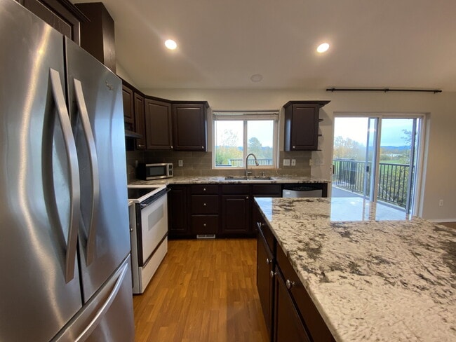 Building Photo - Spacious 4-bedroom with Panoramic Deck Nex...