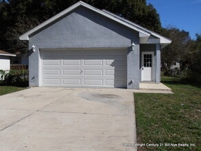 Building Photo - THREE BEDROOMS AND A TWO CAR GARAGE