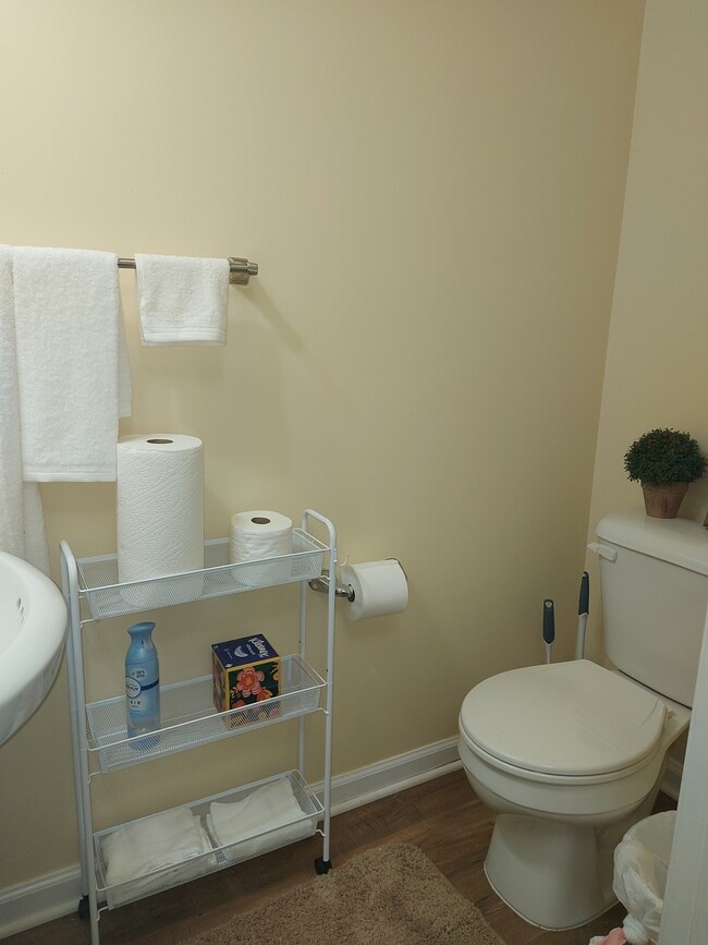 Half bath with towels and more - 7021 Holly Springs Ln