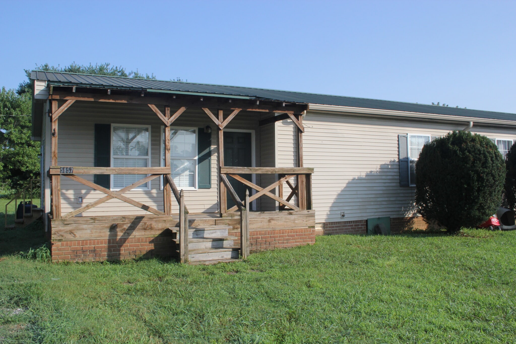 Front of the unit with covered proch - 5857 Highway 161